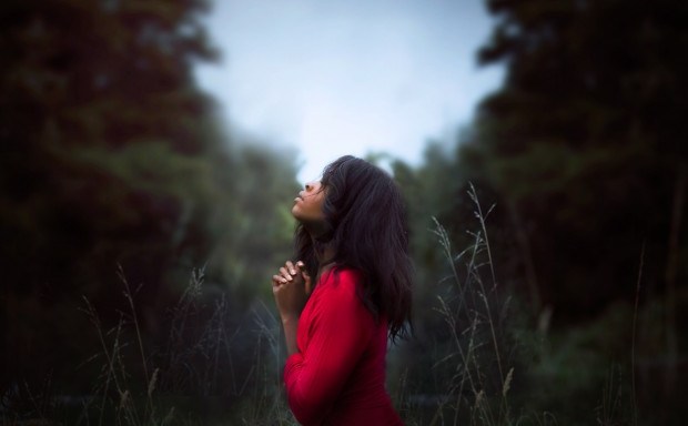 black woman reflecting praying pexel