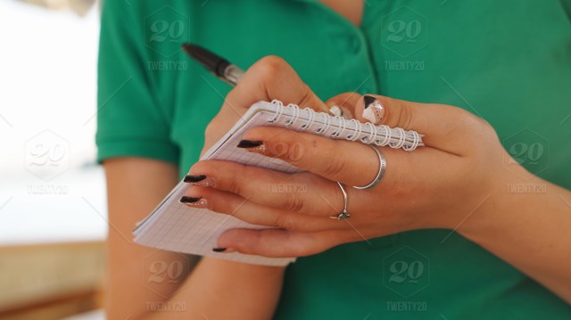 waitressstock-photo-preparation-green-celebration-hands-party-writing-planning-notes-st-patricks-day-ac669383-78e7-47f6-9bdb-f3aa6586f893