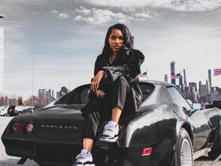woman-sitting-on-corvette-1842109