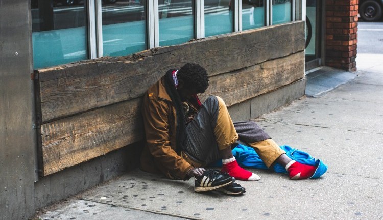man-sitting-on-street-2239908