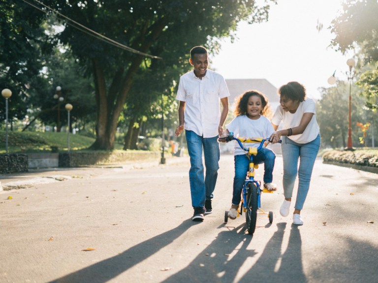 man-standing-beside-his-wife-teaching-their-child-how-to-homeschooling-pexels
