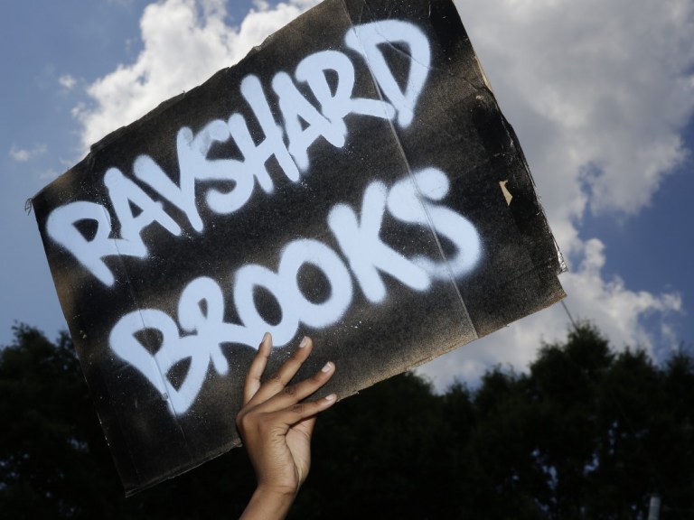 protest sign of rayshard brooks – AP