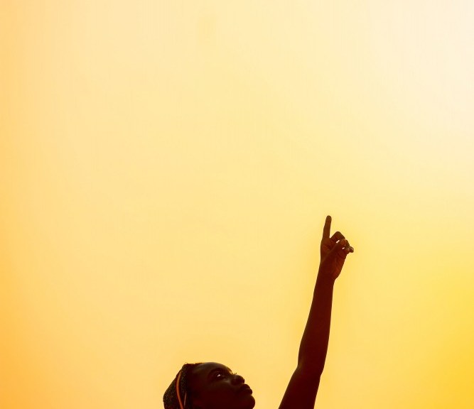 pexels-clement-eastwood-black woman pointing sun