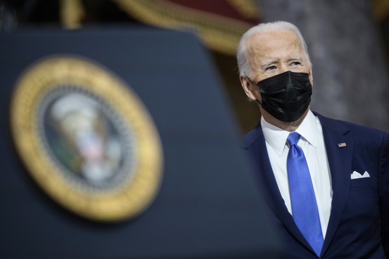 Biden Decries Trump Backers’ ‘dagger at throat’ of Democracy